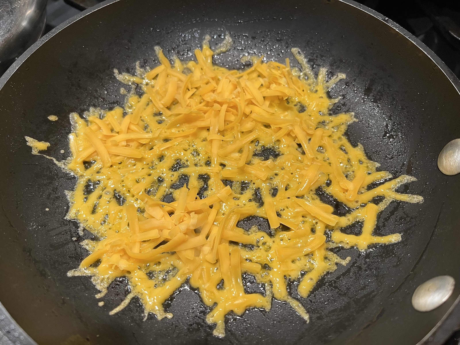 Sprinkle skillet with cheese