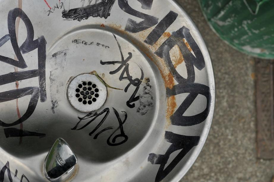 Sink with graffiti and vandal-resistant faucets