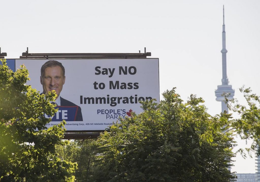 A People's Party of Canada billboard with the party leader Maxime Bernier and the message 'Say NO to Mass Immigration".