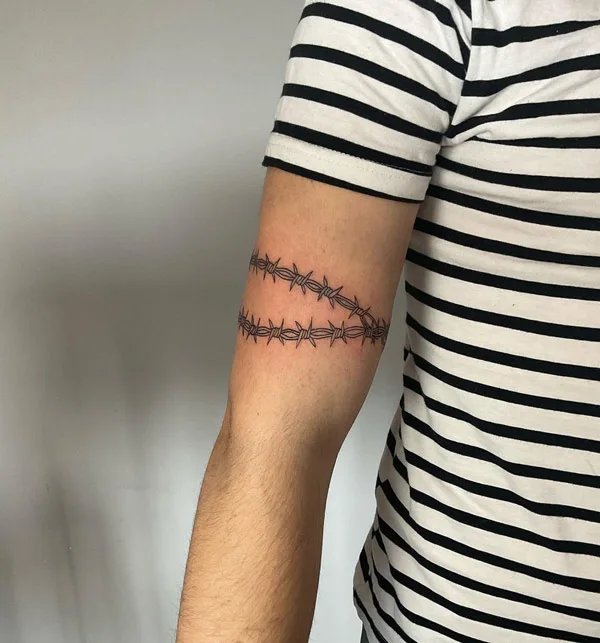 Close view of the arm barbed wire tat design