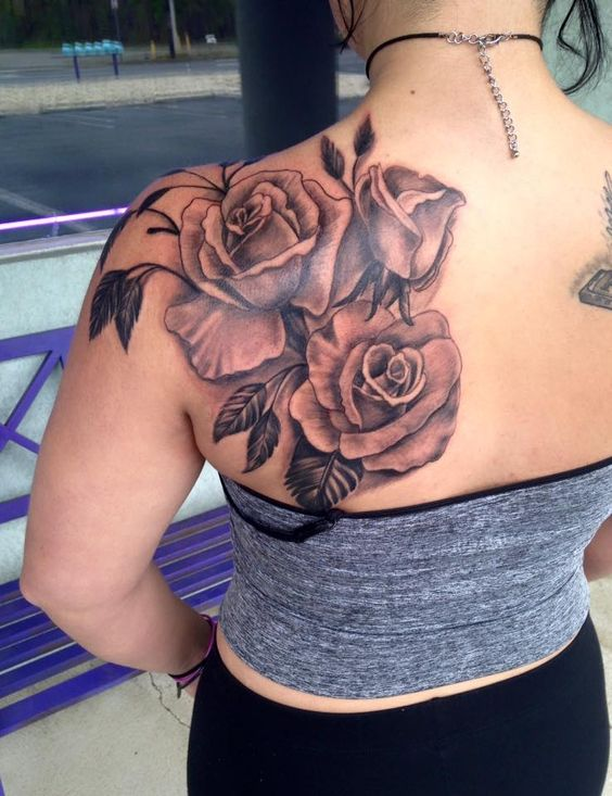 lady wearing rose flower tattoo on her shoulder