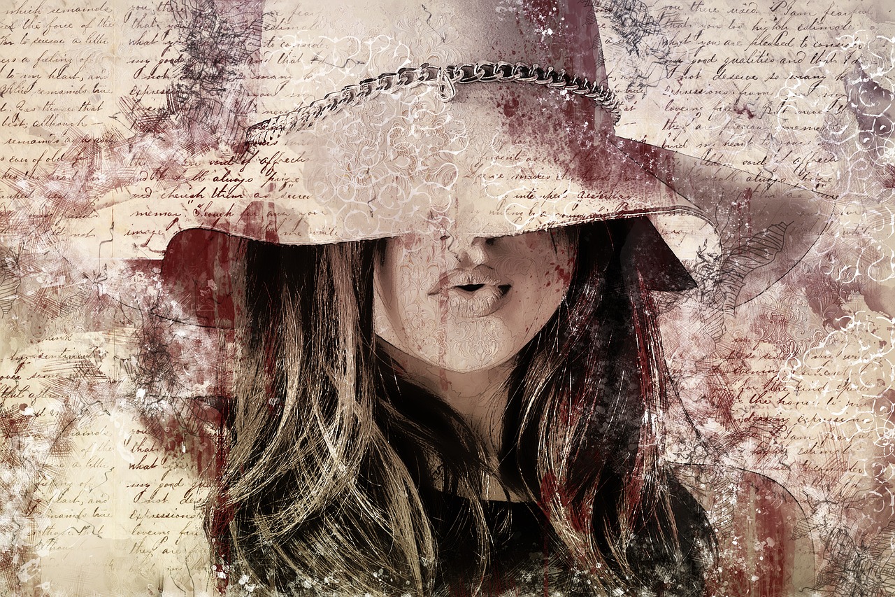 An image of woman with her face mainly covered by her hat. Her lips are pursed to indicate she is forming a sound
