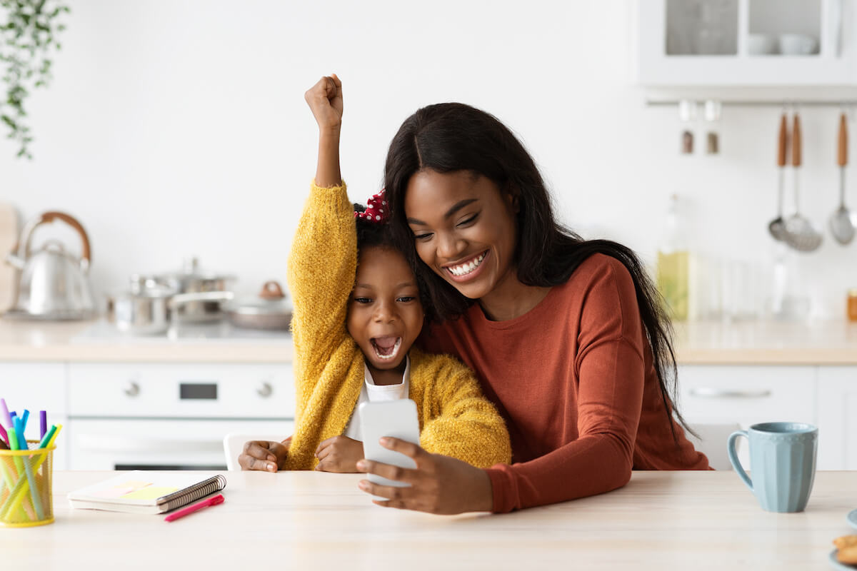 Mental health software: mother and daughter watching something on their phone