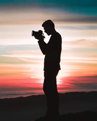 Man clicking photo from camera