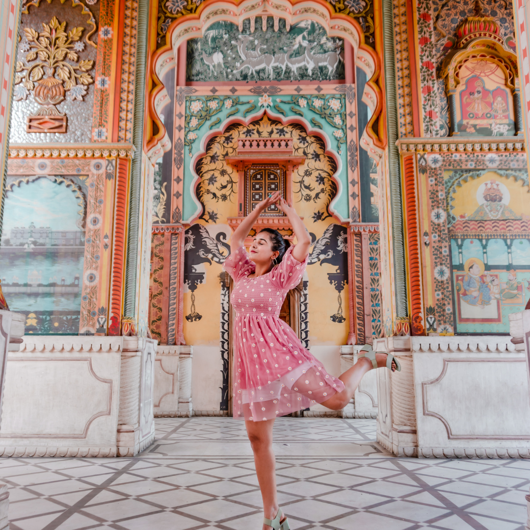  A girl dancing in city Palace Jaipur and getting a photoshoot done for Instagram