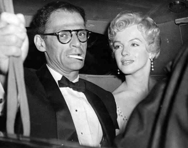 American film actress Marilyn Monroe and her husband, American playwright, Arthur Miller arrive at the Berkshire home of playwright, Terence Rattigan...