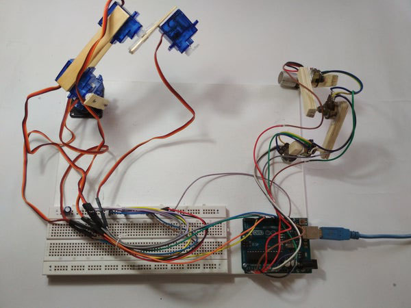 Connecting the Wires and pieces of wood on the breadboard