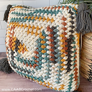 bean stitch pillow with tassels on ends