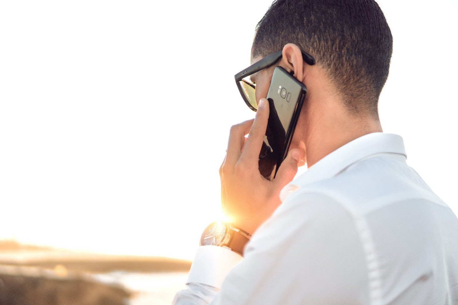 man calling customer service from cell phone