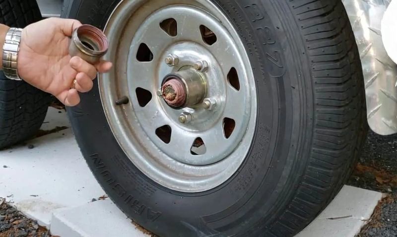 How to Grease Your Travel Trailer Wheel Bearings Remove the Dust Cap and Wheel