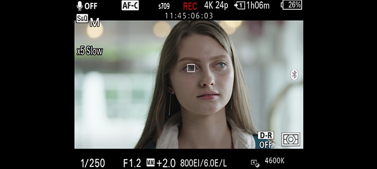 Woman’s face with square autofocus mark tracking her eyes