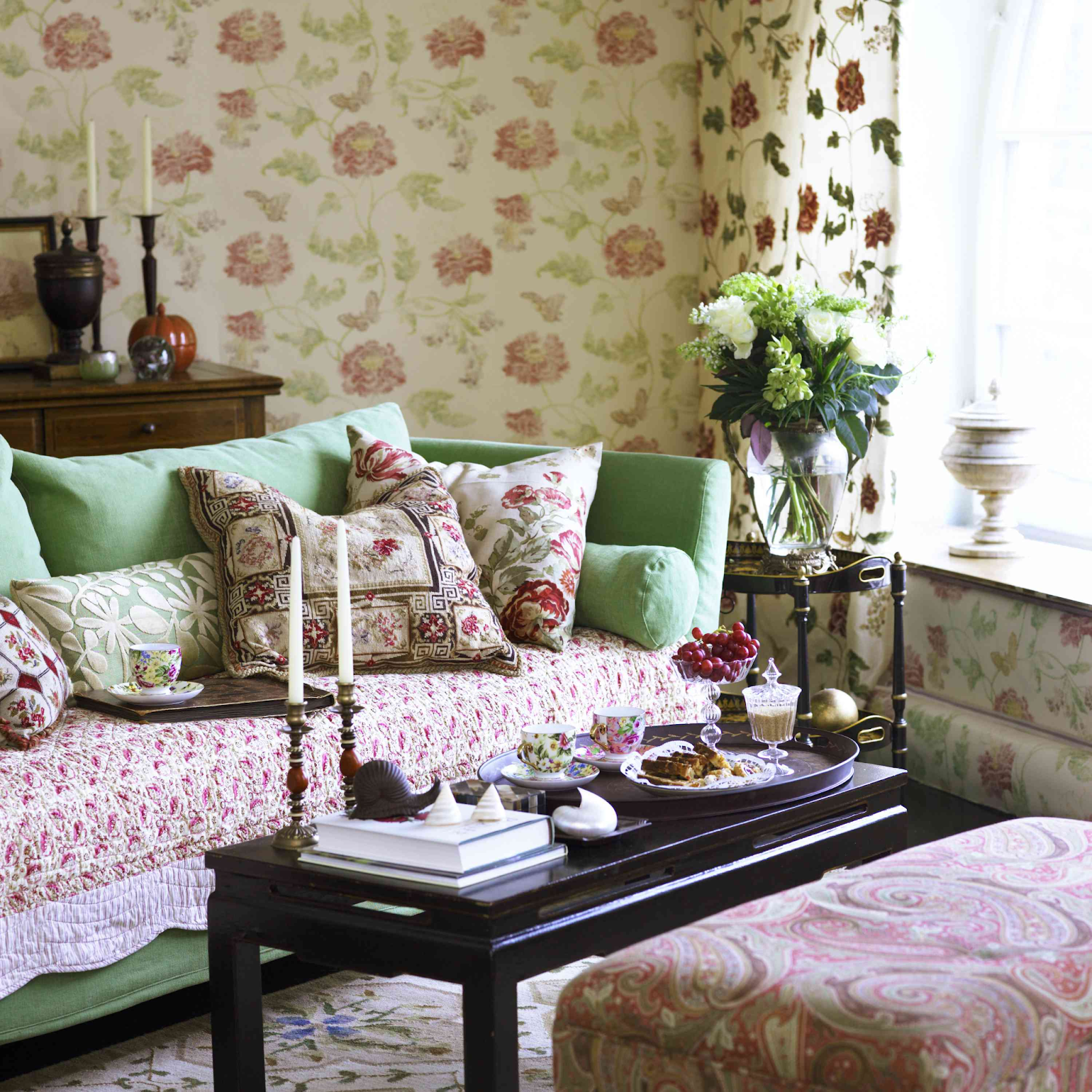 Granny chic design with chintz-style floral decor used for curtains, upholstery, and wallpaper