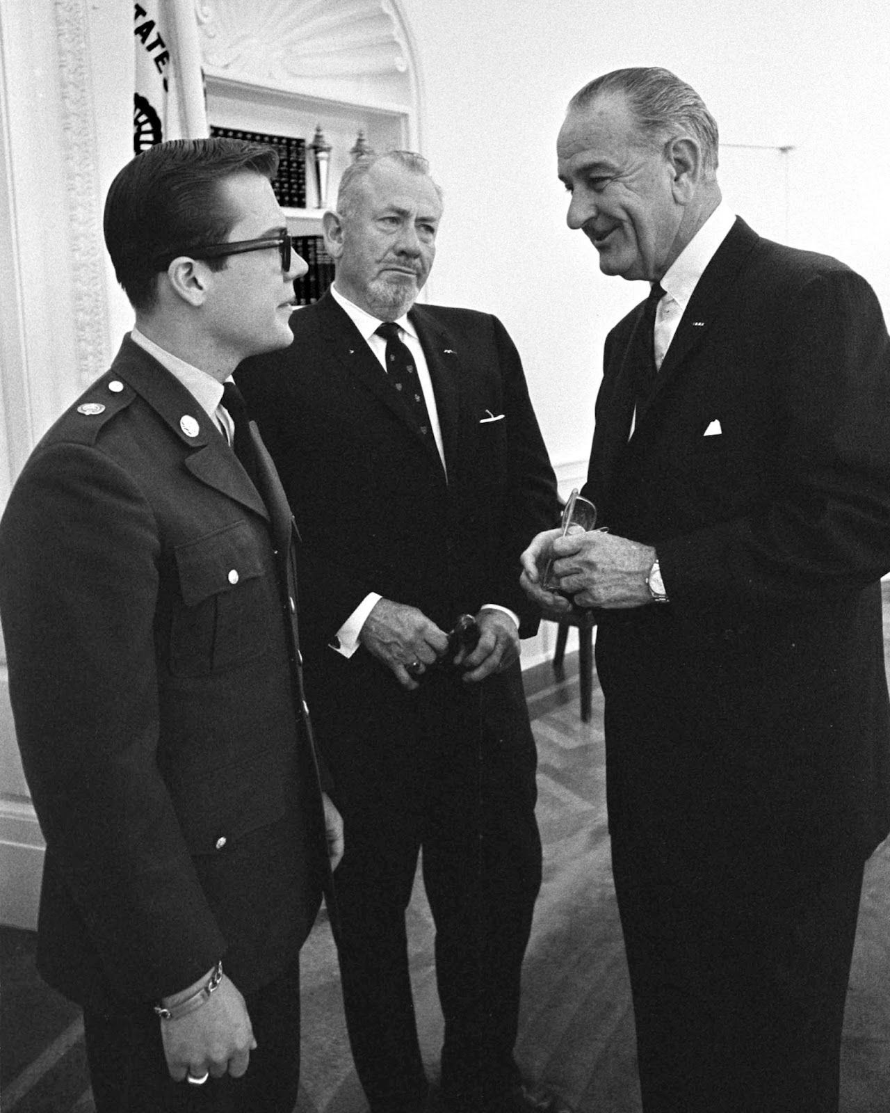A photo of John Steinbeck and son John visit LBJ at the White House