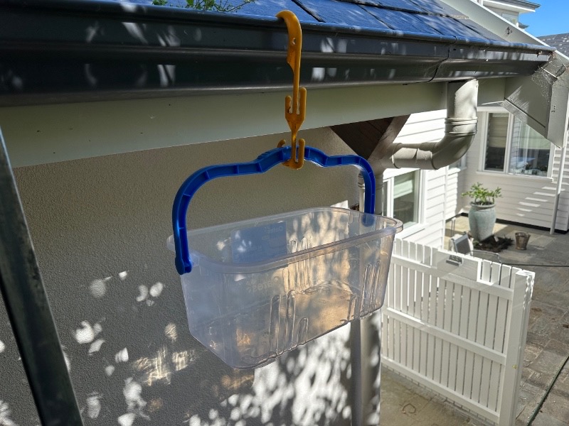 The hook and bucket combination Is still the best gutter cleaning tool