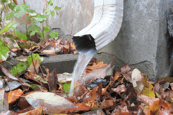 Home gutter showing rainwater falling away from property