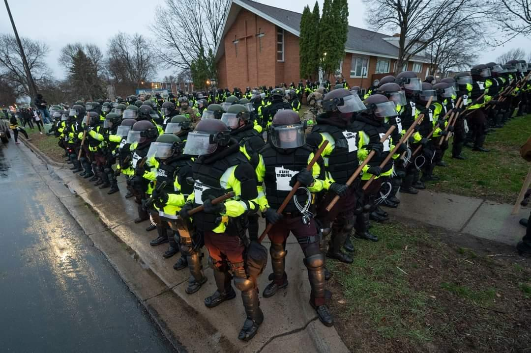 Image of a police officers in riot gear.