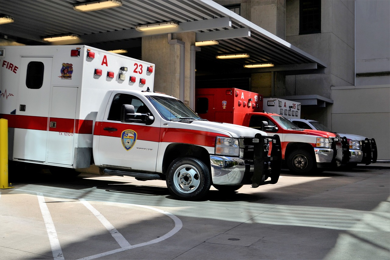 Ambulances unload patients at an emergency room