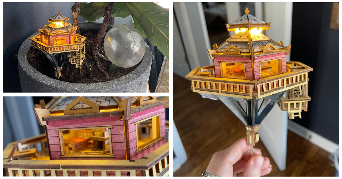 A collage of three photos of a tree house at various scales. One is of the treehouse in a potted plant, another is held closer and the third allows you to see through the window and features details such as a fireplace and bead inside the tiny treehouse.