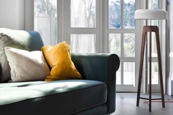modern tripod floor lamp with a traditional wooden legs