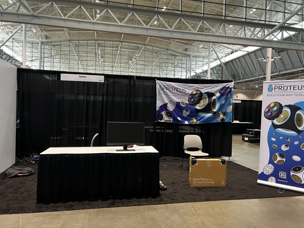 Our booth looking pretty empty with a few signs up.