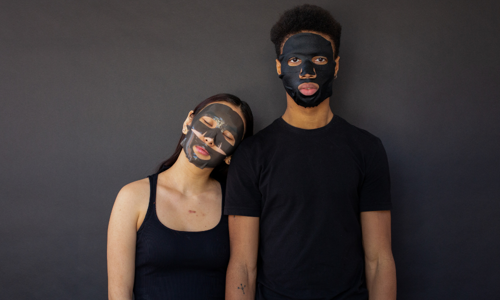 couple doing self care together by doing face masks 