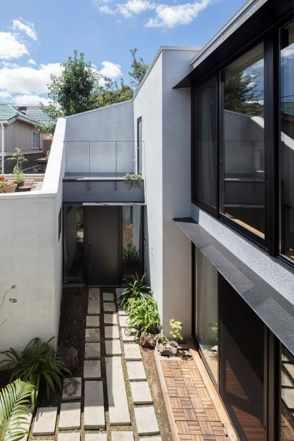 Two Story Concrete House with a Courtyard