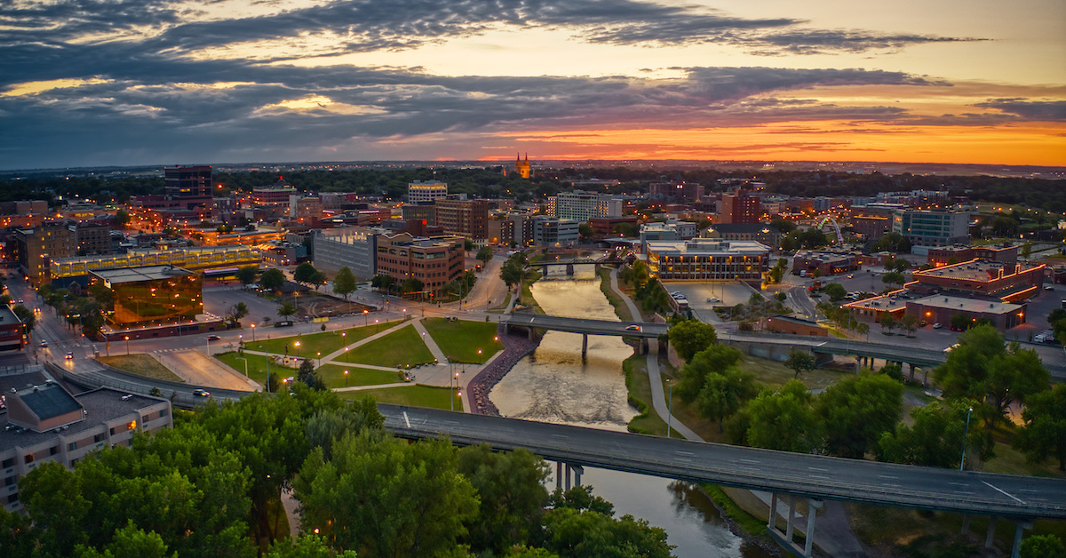 Aerial view of Sioux Falls' skyline at sunset.