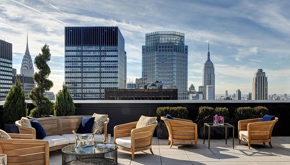 Beautiful Jewel Suite terrace at Lotte New York Palace hotel, with a view of iconic NY skyline.