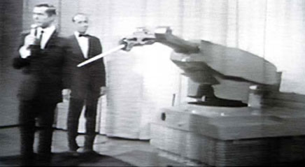 A black and white image of Unimate, the first industrial robot. 