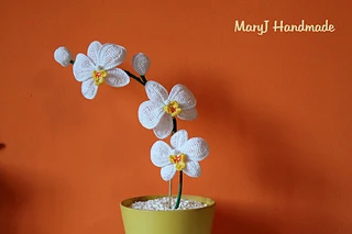 crochet orchid on orange background