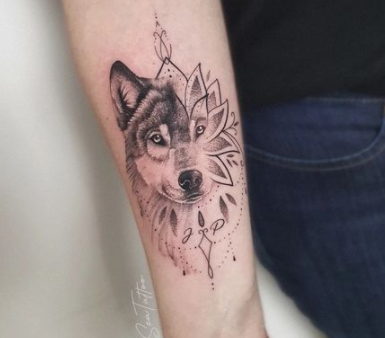 Lotus And Wolf Forearm Tattoo