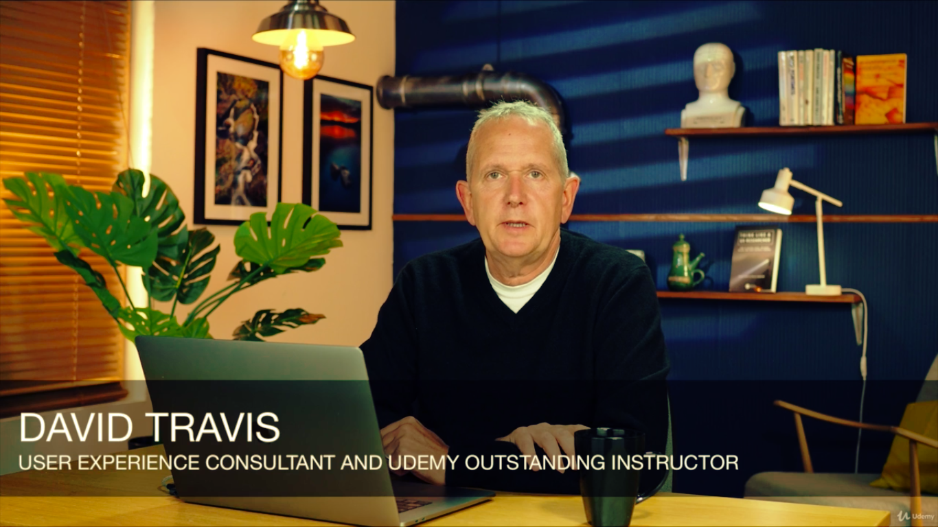 an instruction sitting at his desk