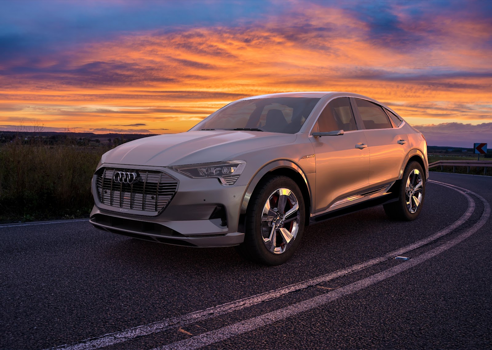 Audi e-tron Sportback on the road with a sunset.