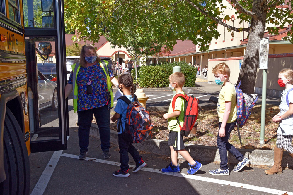 Madison students boarding a bus Madison students boarding a bus