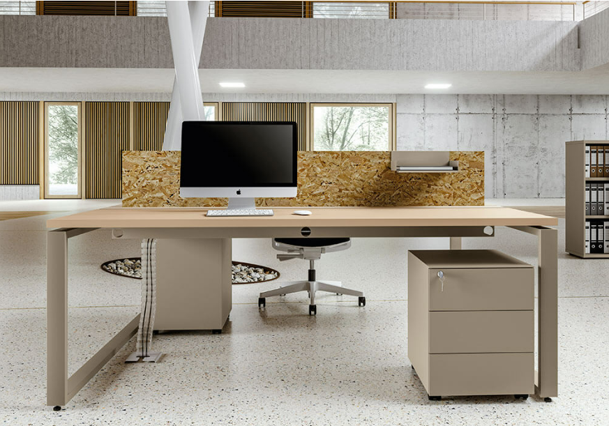 An operator’s office desk with a dividing screen to add some privacy in an office with open space planning.