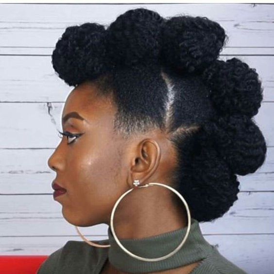 lady wearing her natural hair in puffs