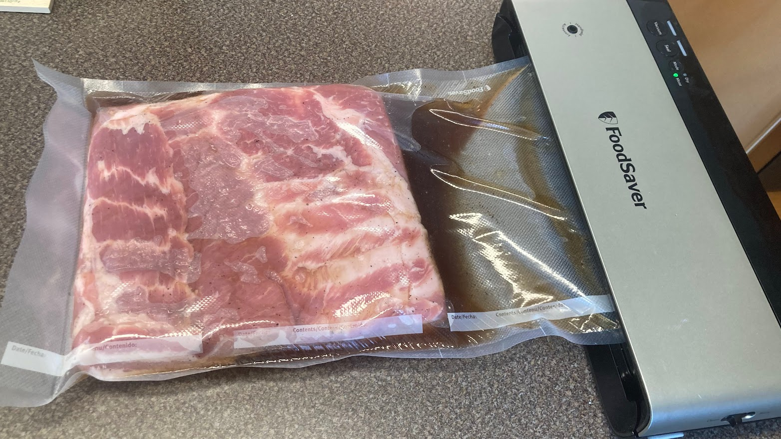 pork belly in a vacuum bag to cure for bacon - grillers gold blog