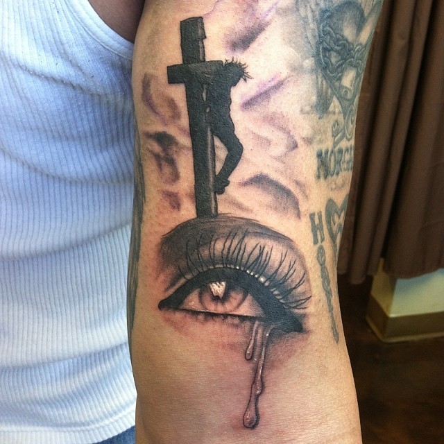 Crying Eye And Black Cross Tattoo