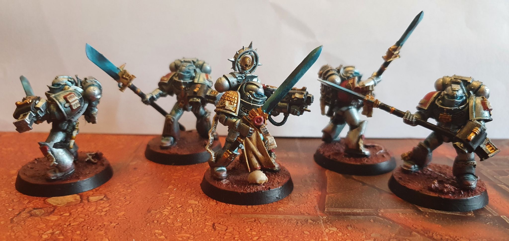 Silver to deep turquose armour, accented with gold.  The Force weapons are deep turquoise to bright blue.  They are on martian sand effect bases, some with light rocks and wire.