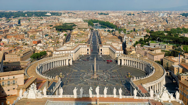 18) Vatican City and Italy - The entrance to the famous St. Peter’s Square marks the border between Italy and the sovereign Catholic city-state of Vatican City.
