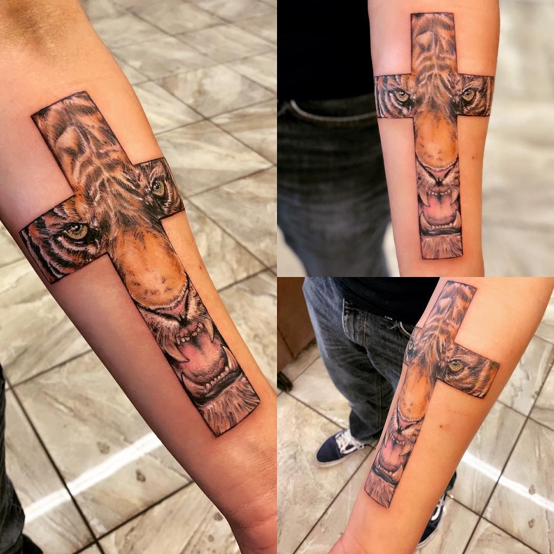 Brown Tiger in Cross Arm Tattoo