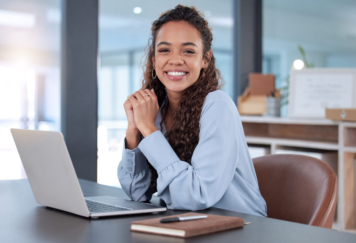 Entrepreneur smiling and looking at the camera