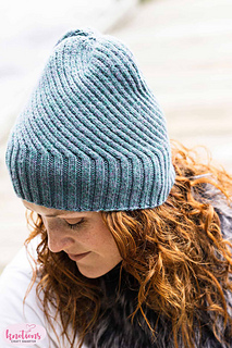 spiral cable knit hat on woman's head