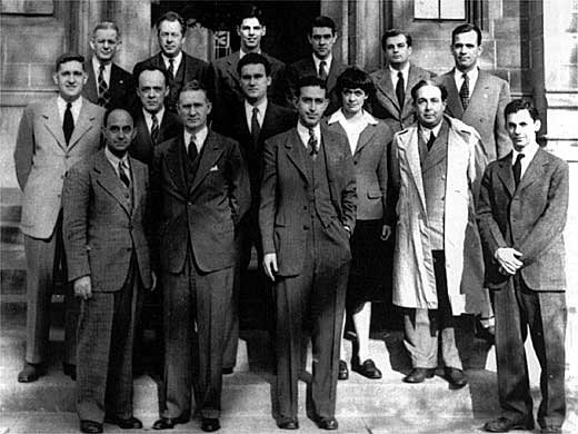 A group of men posing for a photo

Description automatically generated