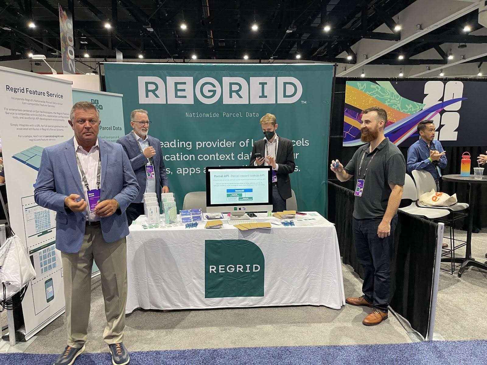 The Regrid Team gathered around our booth and ready to meet potential customers