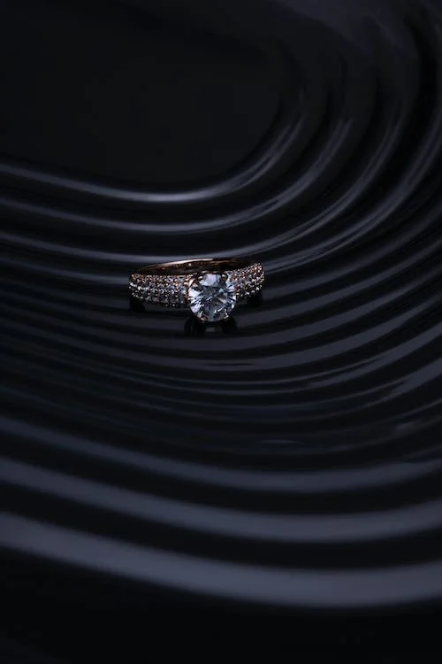 Luxurious diamond engagement ring showcased on black backdrop