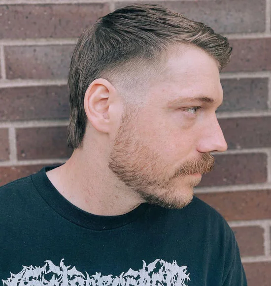 Man shows off his casual burst fade mullet