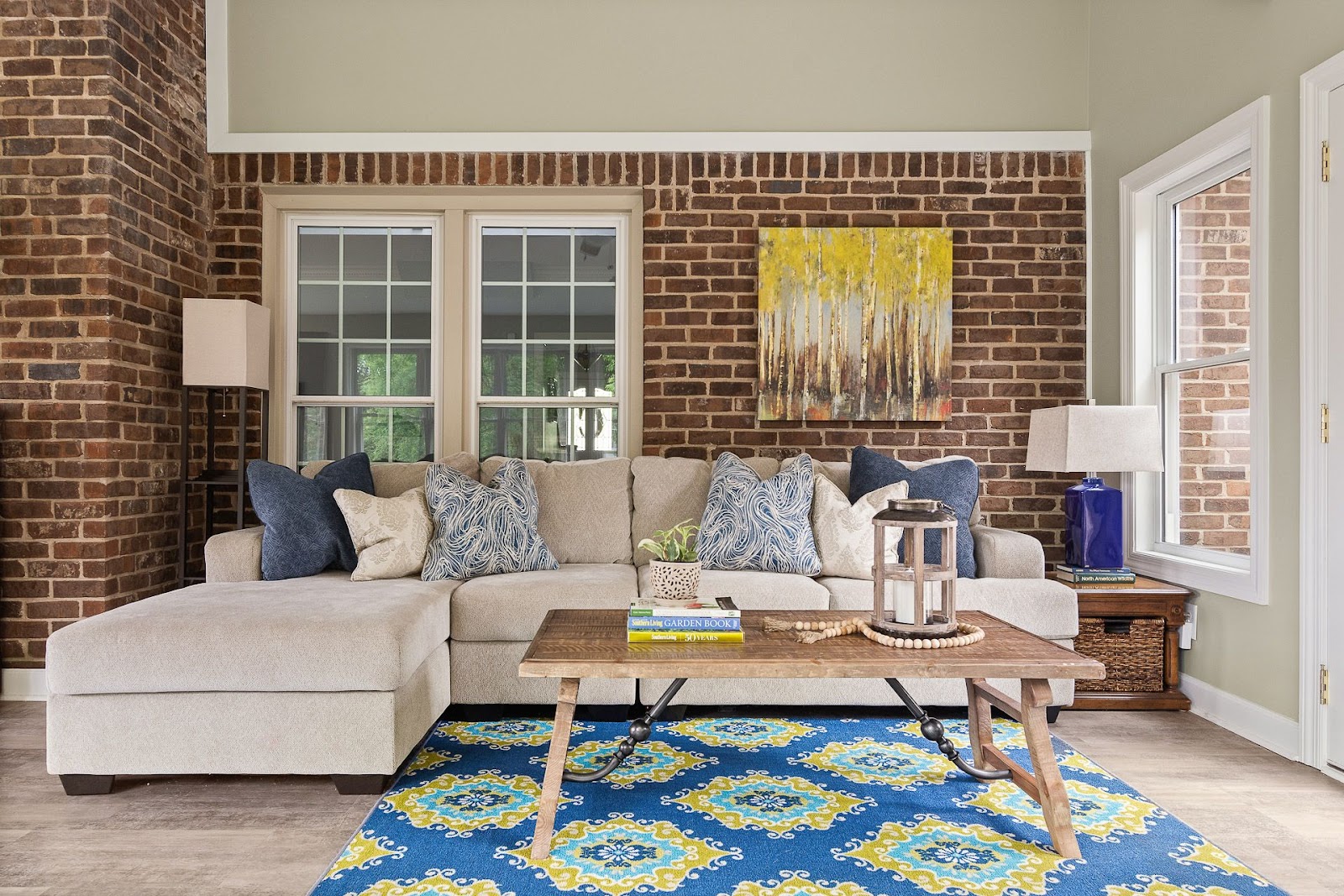 finished sunroom lebanon tennessee brick neutral paint lots of sunlight new flooring remodel art blue yellow traditional