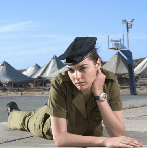 Gal Gadot posing in her military uniform.