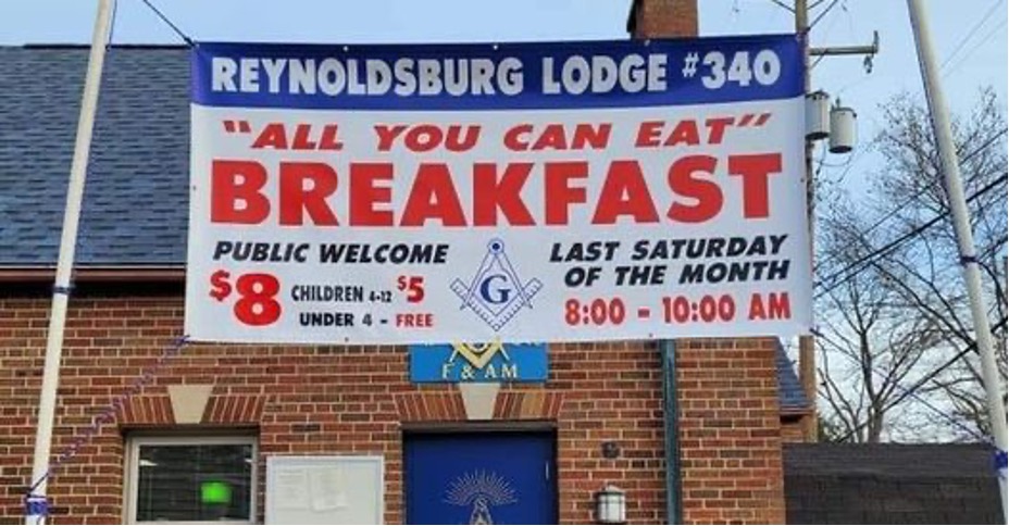 Image of a sign for a monthly community breakfast.